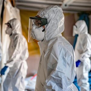 e22f560c-f0907a1f-55ec-4dc6-a8e9-41b9fac35b06.webp Workers in protective gear conducting asbestos removal, emphasizing safety protocols in disaster recovery.